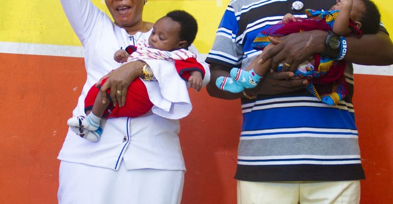 Dr. P.I.A. & Mrs. Favour O. Obaseki celebrating with the children at Emmanuel Orphanage Home